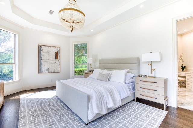 bedroom featuring a chandelier, crown molding, and multiple windows