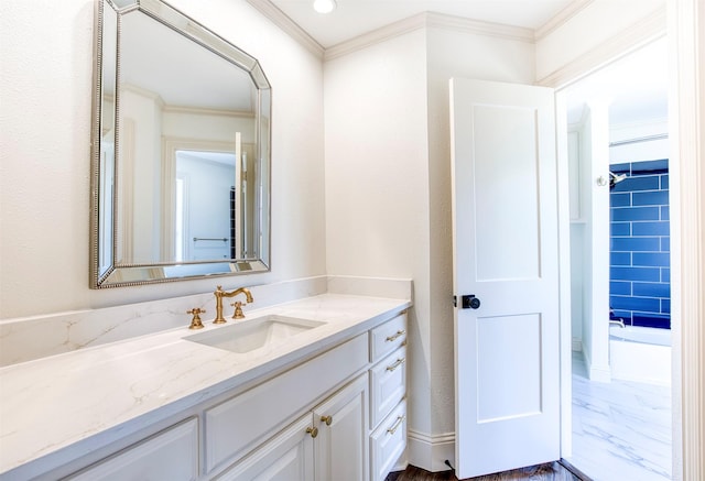 bathroom featuring ornamental molding, marble finish floor, and vanity