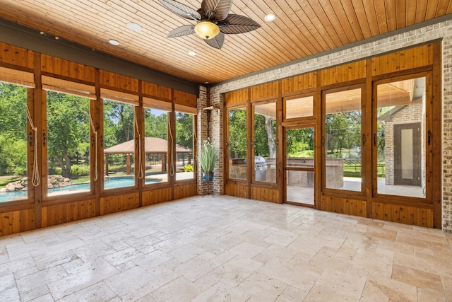 4161 San Juan Ave, Prosper, TX 75078 - unfurnished sunroom with recessed lighting, stone tile floors, a ceiling fan, and wood ceiling