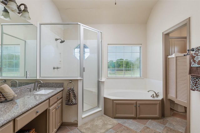 bathroom with a shower stall, a garden tub, and vanity