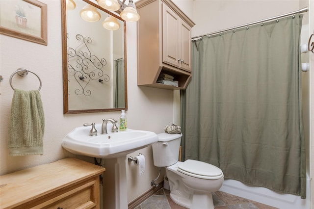 full bath with shower / bath combination with curtain, a sink, and toilet