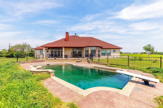 view of pool featuring fence, a patio area, a lawn, and a fenced in pool