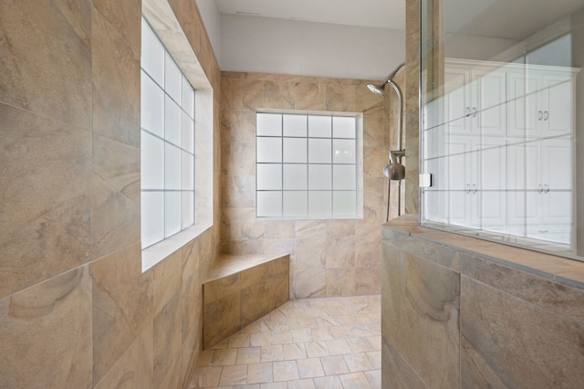 full bath featuring a tile shower