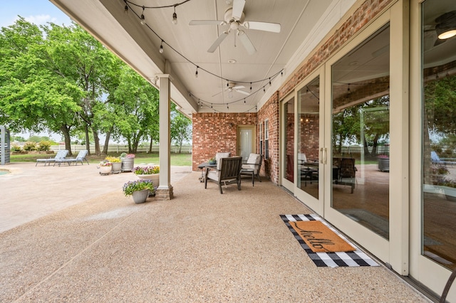 view of patio / terrace with a ceiling fan and french doors