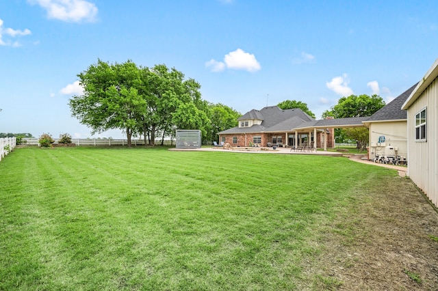 view of yard with fence and a patio area