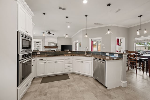 kitchen with a ceiling fan, a sink, appliances with stainless steel finishes, visible vents, and recessed lighting