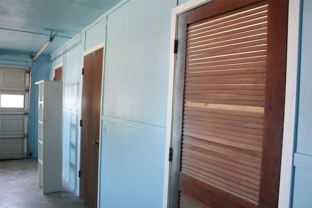 hallway featuring concrete flooring