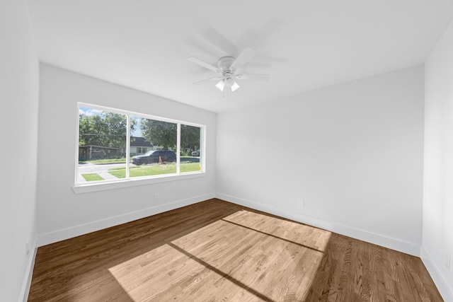3712 Utah Ave, Dallas, TX 75216 - spare room with baseboards, a ceiling fan, and wood finished floors