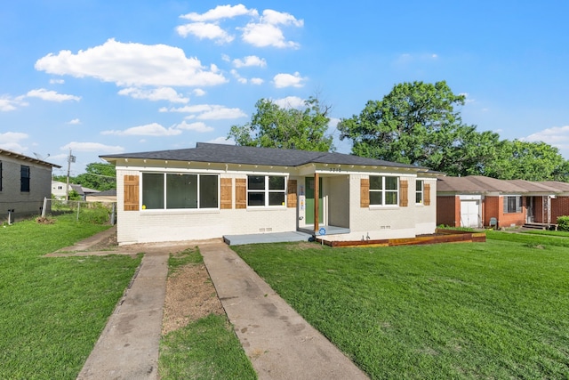 3712 Utah Ave, Dallas, TX 75216 - view of front of property with brick siding, fence, and a front yard