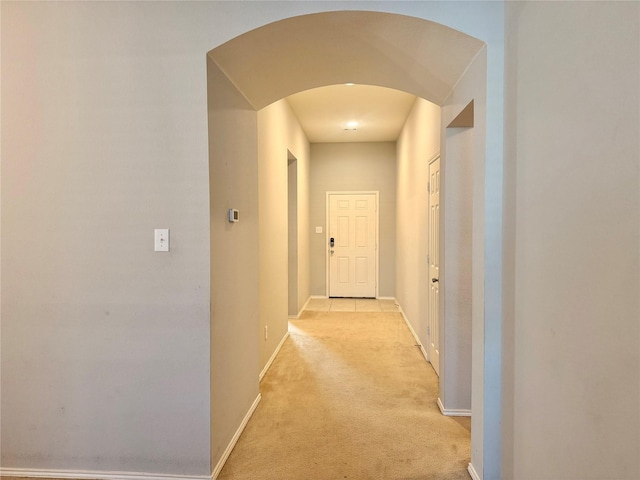 1131 Grimes Dr, Forney, TX 75126 - hall featuring arched walkways and light colored carpet