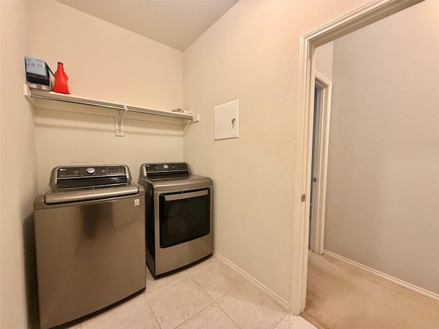 1131 Grimes Dr, Forney, TX 75126 - washroom with separate washer and dryer and light tile patterned floors