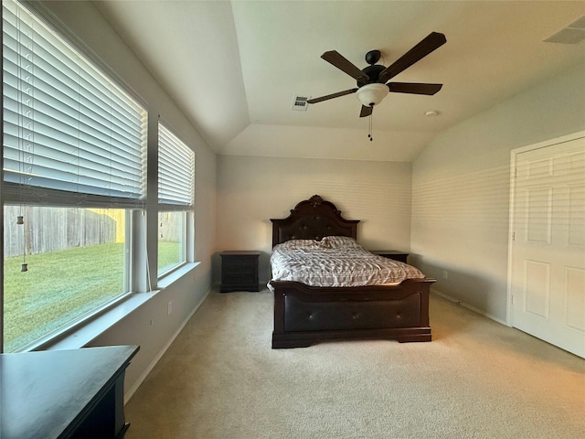 1131 Grimes Dr, Forney, TX 75126 - bedroom with multiple windows, carpet flooring, vaulted ceiling, and ceiling fan