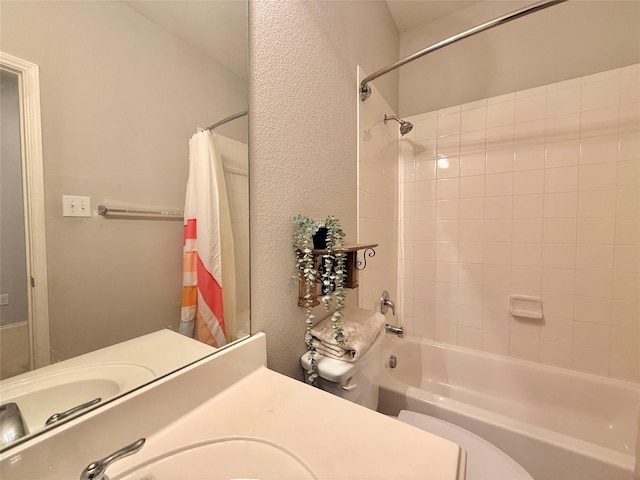 1131 Grimes Dr, Forney, TX 75126 - bathroom featuring shower / tub combo, a textured wall, and vanity