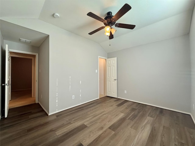 1131 Grimes Dr, Forney, TX 75126 - unfurnished bedroom featuring lofted ceiling, wood finished floors, and a ceiling fan