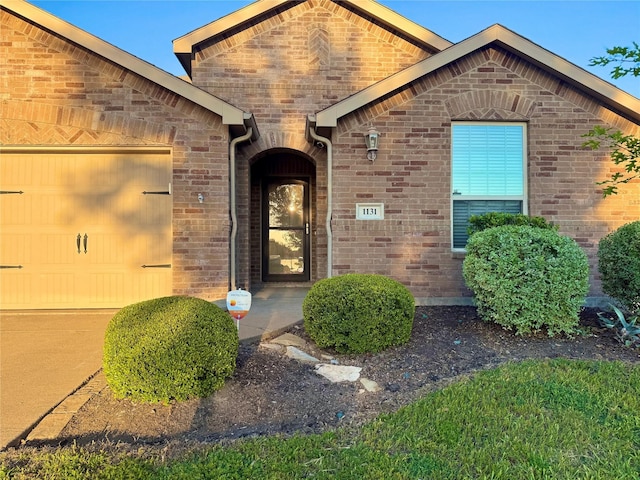 1131 Grimes Dr, Forney, TX 75126 - doorway to property with brick siding and an attached garage
