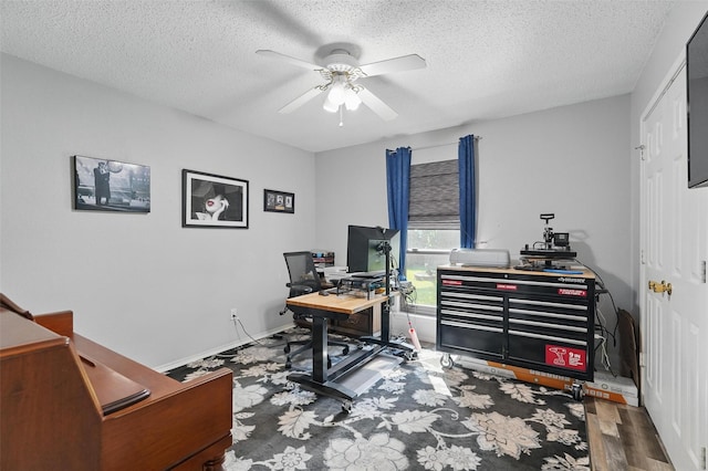 office with wood finished floors, baseboards, a textured ceiling, and ceiling fan