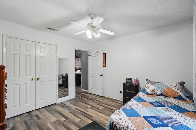 107 Princeton Cir, Forney, TX 75126 - bedroom featuring wood finished floors, a closet, ceiling fan, a textured ceiling, and baseboards