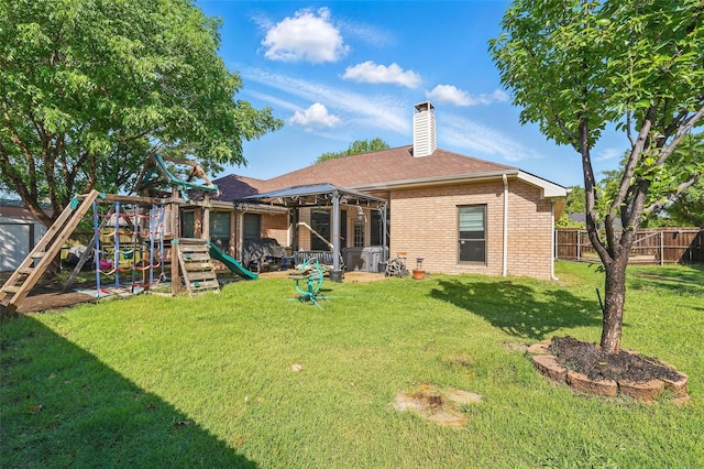 107 Princeton Cir, Forney, TX 75126 - back of house with brick siding, a playground, a chimney, and roof with shingles