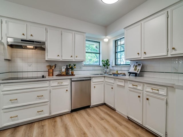 kitchen with stainless steel dishwasher, a sink, white cabinetry, black electric cooktop, and under cabinet range hood