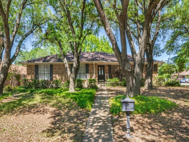 ranch-style house with brick siding and covered porch