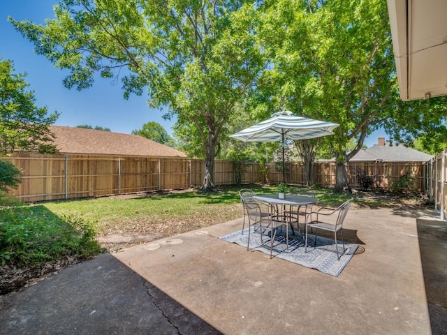 view of patio / terrace with a fenced backyard and outdoor dining space