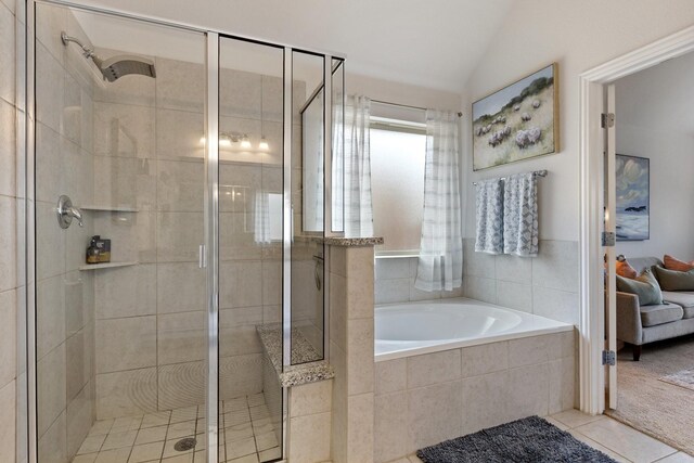 2452 Open Range Dr, Fort Worth, TX 76177 - ensuite bathroom featuring a garden tub, a stall shower, lofted ceiling, and tile patterned flooring