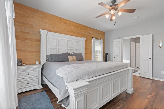 3001 Shoreline Dr, Burleson, TX 76028 - bedroom with dark wood finished floors, ceiling fan, and wooden walls