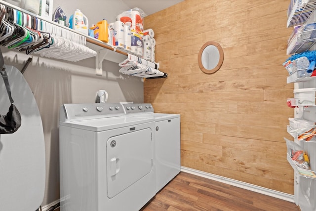 3001 Shoreline Dr, Burleson, TX 76028 - laundry room featuring wooden walls, separate washer and dryer, wood finished floors, and baseboards