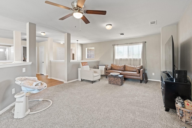 3001 Shoreline Dr, Burleson, TX 76028 - carpeted living area featuring a ceiling fan and baseboards