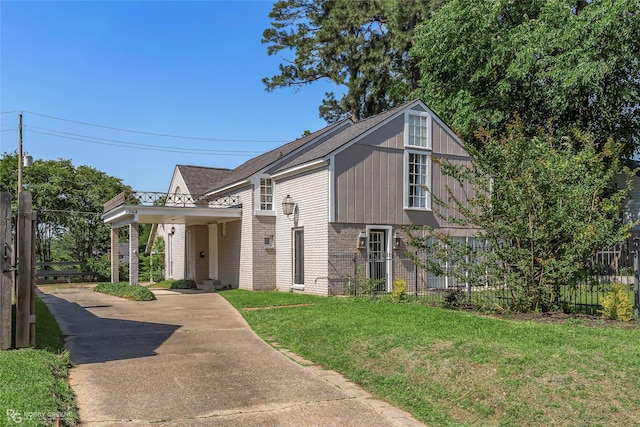view of front of property featuring concrete driveway and brick siding