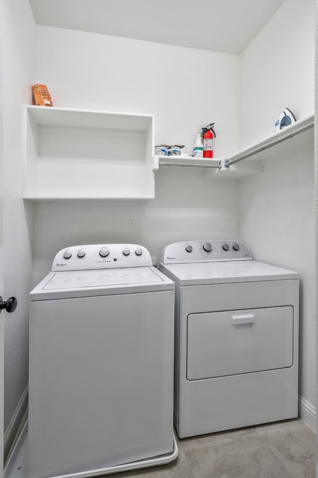 washroom with washer and dryer and laundry area