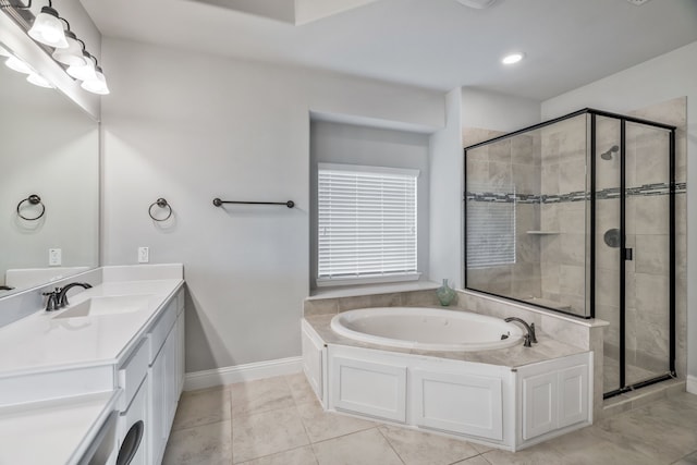 full bath featuring a shower stall, a garden tub, vanity, baseboards, and tile patterned flooring