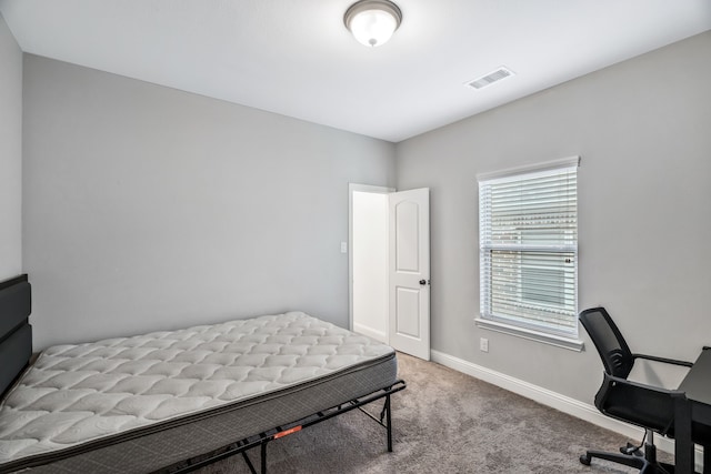 carpeted bedroom with baseboards and visible vents
