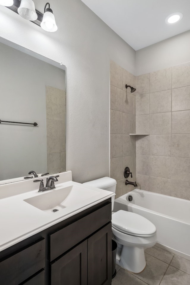 bathroom with tile patterned flooring, shower / bathing tub combination, toilet, and vanity