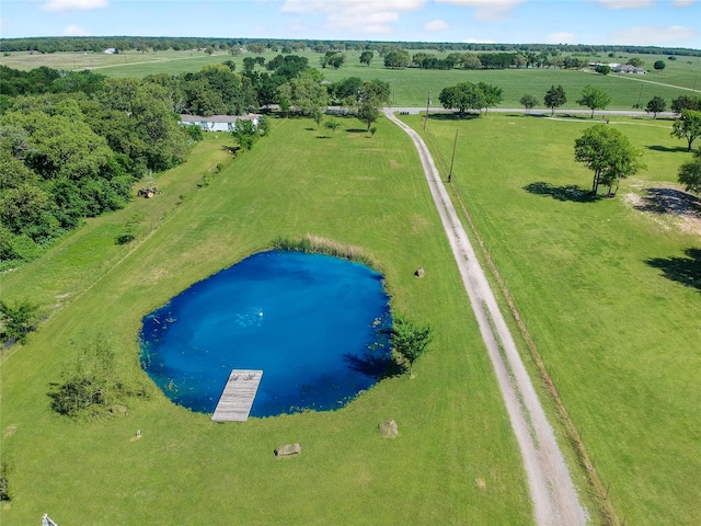 birds eye view of property with a water view and a rural view