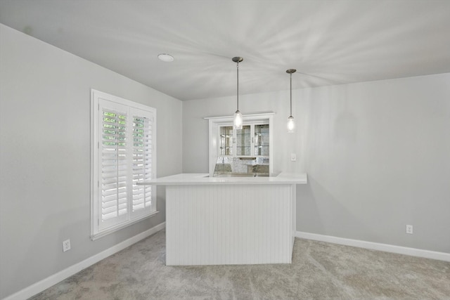 3141 La Kenta Cir, Farmers Branch, TX 75234 - kitchen featuring baseboards, carpet floors, pendant lighting, and light countertops