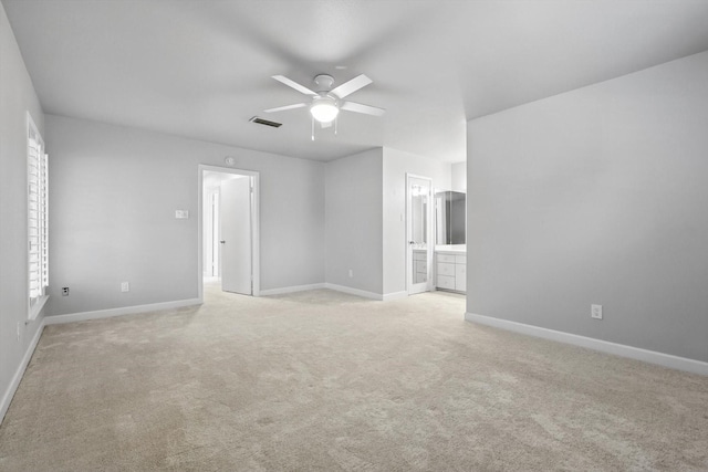 3141 La Kenta Cir, Farmers Branch, TX 75234 - empty room with light carpet, a ceiling fan, and baseboards
