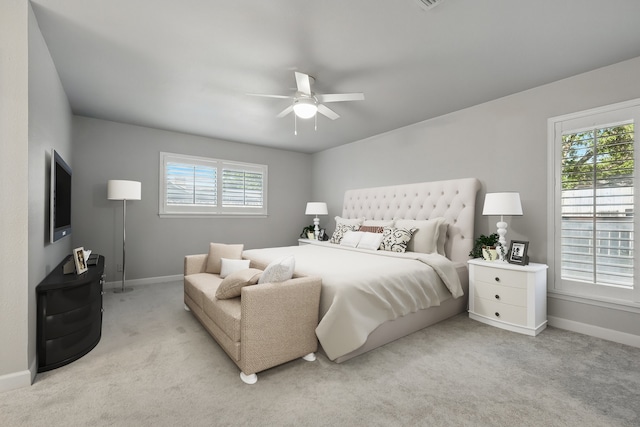 3141 La Kenta Cir, Farmers Branch, TX 75234 - bedroom with baseboards, light carpet, and a ceiling fan