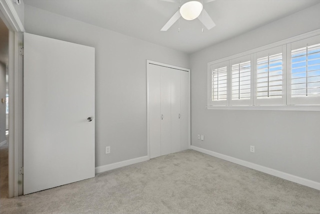 3141 La Kenta Cir, Farmers Branch, TX 75234 - unfurnished bedroom featuring carpet, multiple windows, a closet, and baseboards
