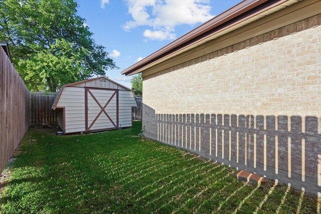 3141 La Kenta Cir, Farmers Branch, TX 75234 - view of yard with a storage unit and an outbuilding