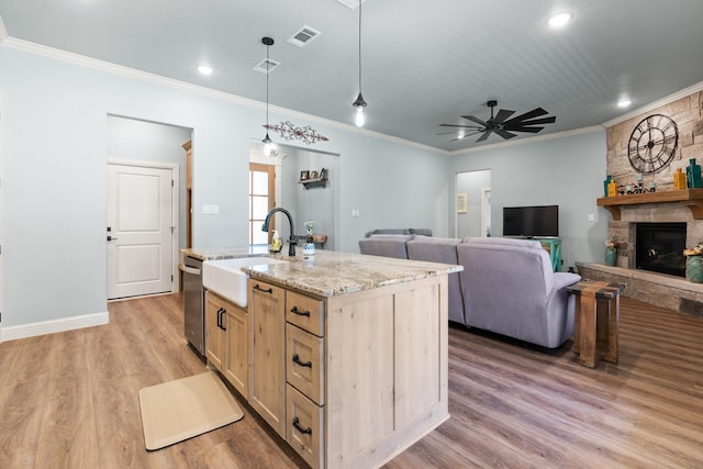 1295 County Road 2030, Glen Rose, TX 76043 - kitchen featuring dishwasher, ornamental molding, light wood-style flooring, a ceiling fan, and pendant lighting