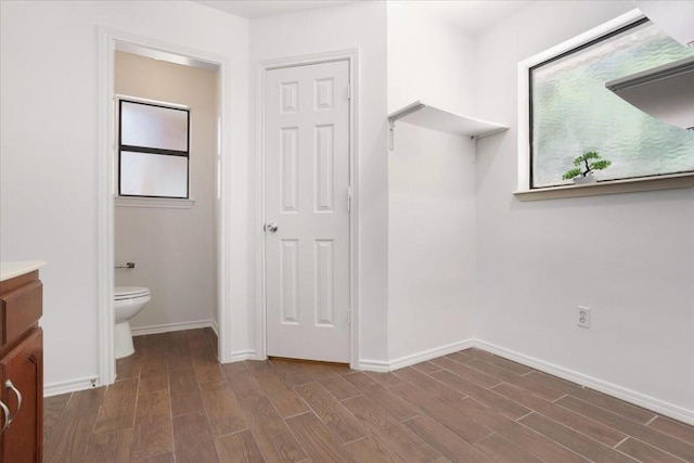 102 Park Cir, Mckinney, TX 75069 - bathroom with wood finished floors, toilet, baseboards, and vanity