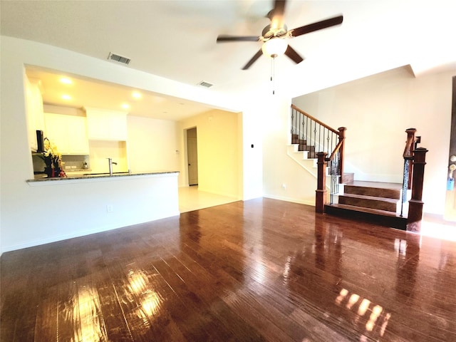 4223 Cascade Sky Dr, Arlington, TX 76005 - unfurnished living room with stairway, wood finished floors, ceiling fan, and visible vents
