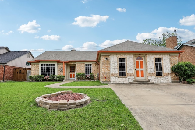 single story home featuring a front lawn, a shingled roof, stone siding, a chimney, and fence