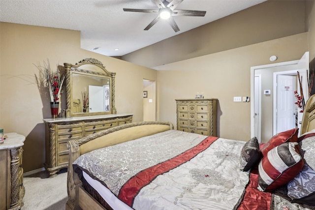bedroom with baseboards, a ceiling fan, lofted ceiling, and light colored carpet
