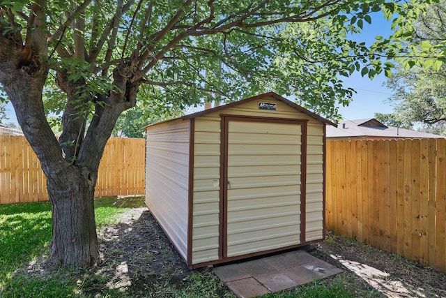 view of shed featuring a fenced backyard