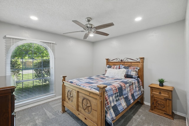 carpeted bedroom featuring a ceiling fan, baseboards, and recessed lighting