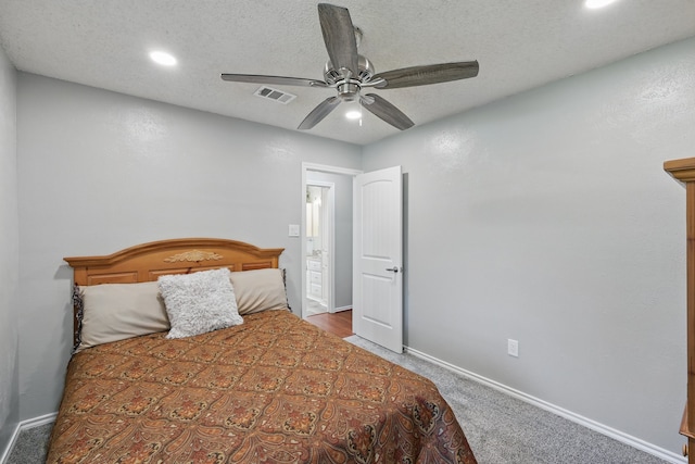 carpeted bedroom featuring baseboards, a ceiling fan, visible vents, and recessed lighting