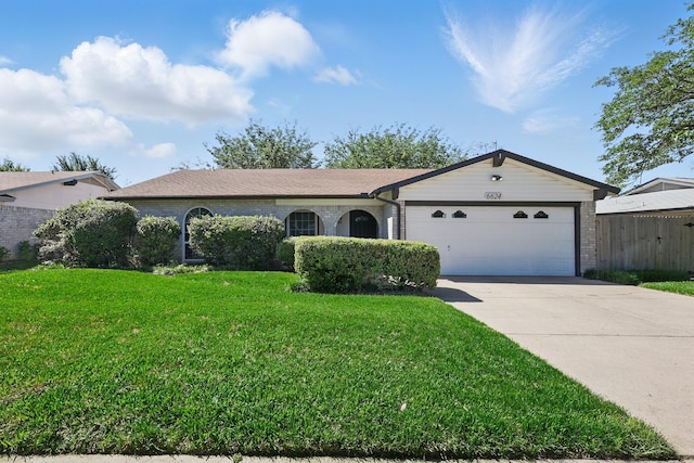 ranch-style home featuring fence, concrete driveway, brick siding, a front yard, and a garage
