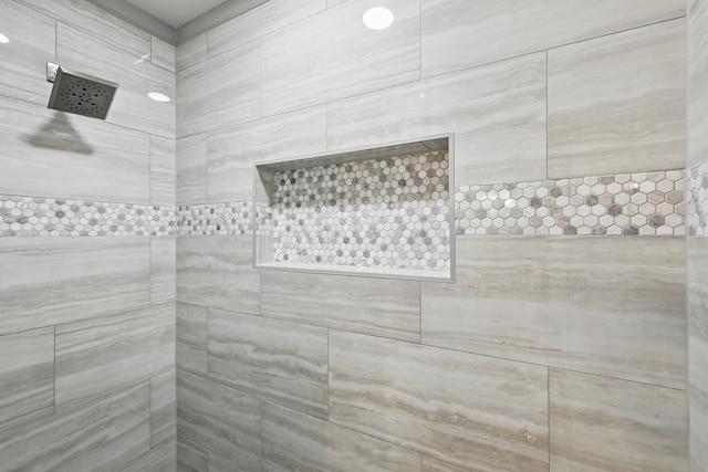 bathroom with a tile shower